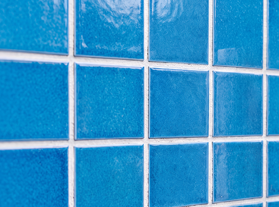 Completed blue pool tile repair